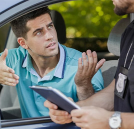 Zoom HD man talking to policeman about ticket